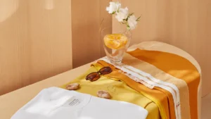 A curated flat lay of 2026 spring summer t-shirts in bold and neutral colors